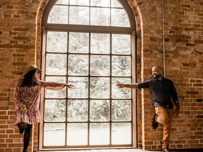 Balanced pose near a large window with city view