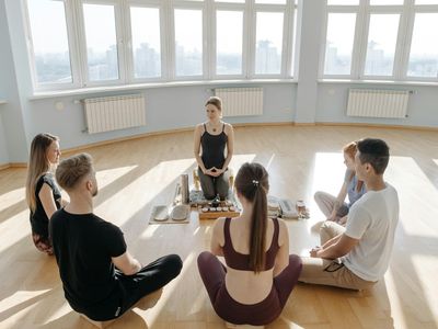 Group of people in a circle practicing mindfulness